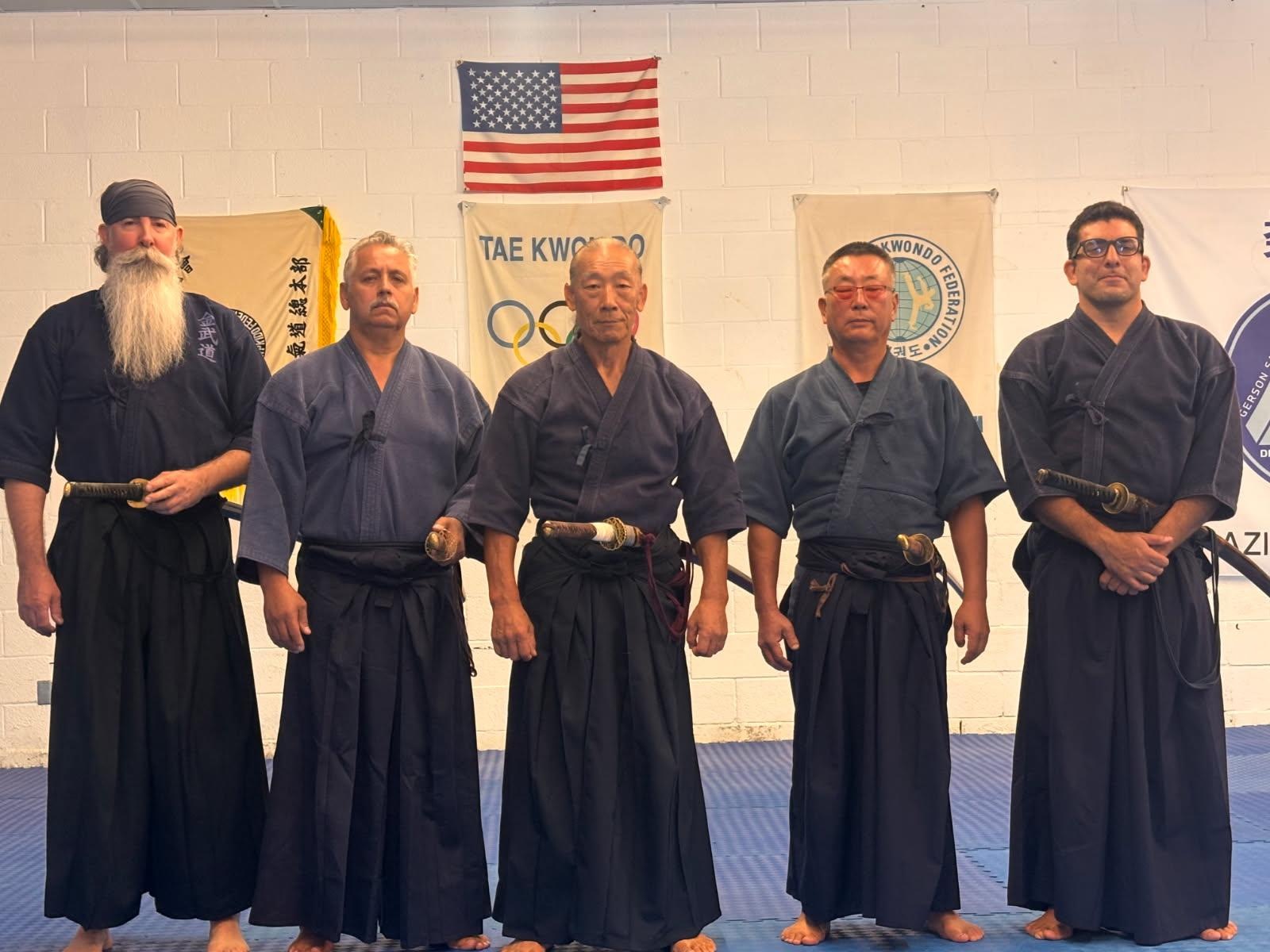 Martial arts practitioners posing in the dojo