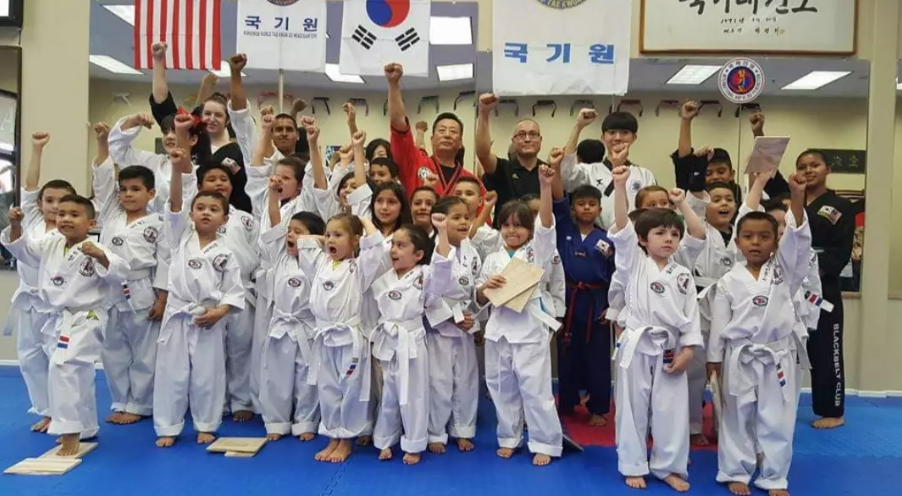 Taekwondo students and instructors posing together